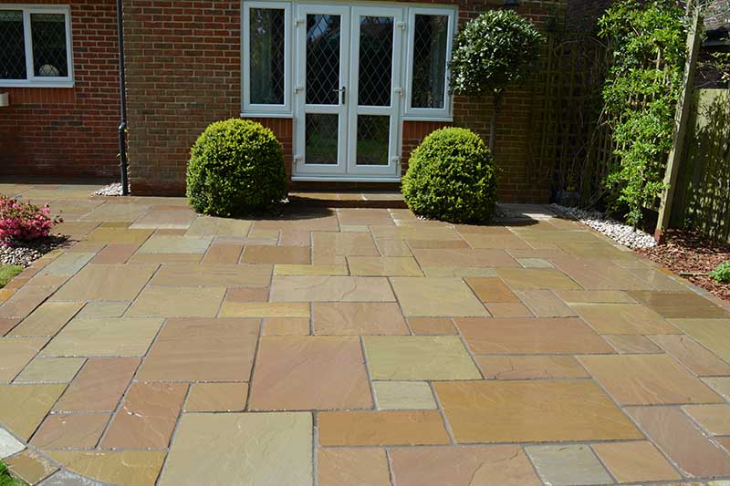 mixed beige paving in back garden